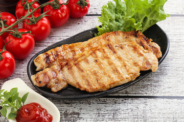 Grilled pork steak with ketchup