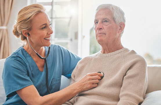 Take A Deep Breath For Me. Shot Of A Female Nurse Listening To Her Patients Chest.