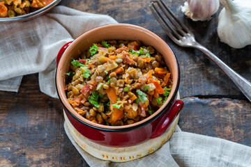 Green lentils stew with white wine, Serrano ham and smoked paprika