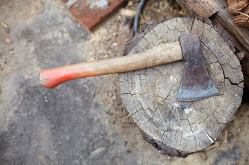 Ax in the stump. Axe for cutting wood. Preparation of firewood for the winter. Selective focus,...