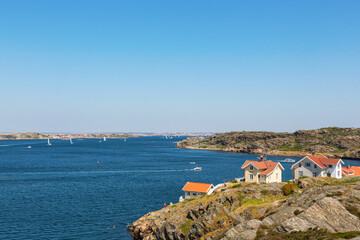 Fototapeta na wymiar View of the sea archipelago with cottages on a cliff at the Swedish west coast