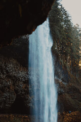 Fototapeta na wymiar behind a waterfall