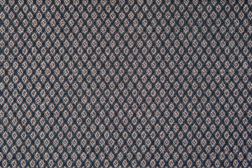 Knitted texture. Texture of jacquard fabric with gray geometric pattern. Crochet mosaic pattern
