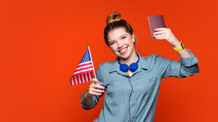 girl holds small USA flag and passport