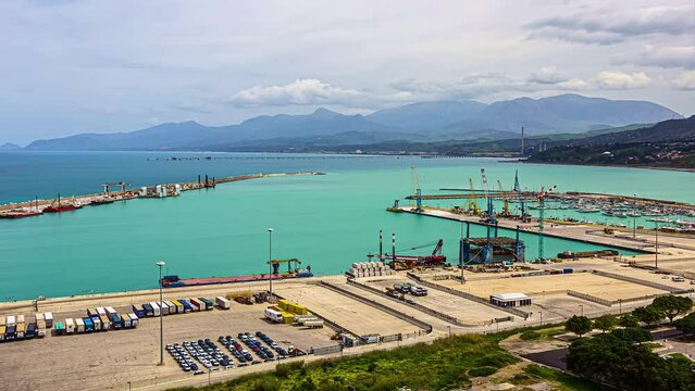 View of the Belvedere Capo Grillo with Vulcanello and the islands Lipari with the rocky peaks Faraglioni and Pietra Lunga in Sicily in Italy with cloud movement in timelapse.