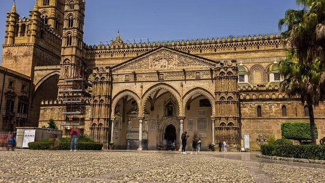 PALERMO, ITALY: Low angle shot of the Cathedral Basilica of the Holy Virgin Mary of the Assumption popularly known as the Cathedral Church at daytime with tourist movement in timelapse.