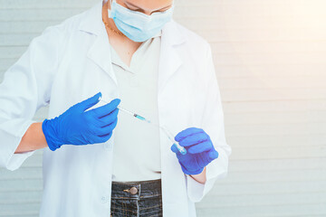 Scientist in uniform holding beaker and test tube have chemical liquid for testing chemical reaction.