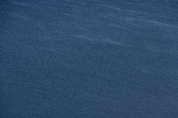 Water surface ripples, waves. Abstract image, wind ripples in water. Beautiful image. Background, textures. Meditation, concentration, peace. Shape of water, movement, from above.