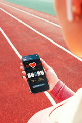 Fitness application. Smartphone screen with sport gym or fitness health mobile application. Girl...