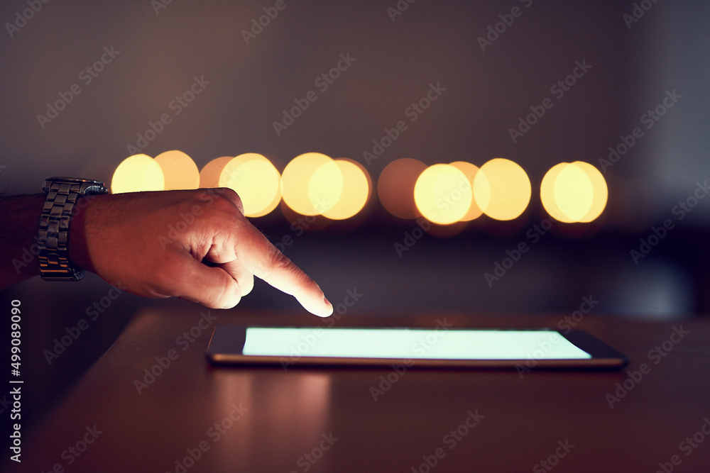 Poster Touchscreen technology. Closeup of a unrecognizable persons hand browsing the internet on a digital tablet at night.