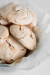 Meringue chocolate. Sweet meringues. Meringue tray. Close up photo of meringues. Dessert Background.