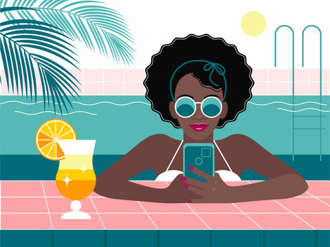 black girl with cocktail and smartphone in the pool