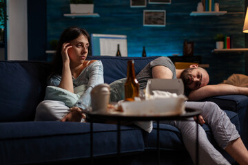 Anxious sad girlfriend and boyfriend suffering in living room, having suicidal thoughts and dealing...