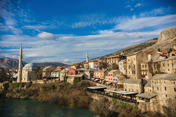 Fototapeta na wymiar Beautiful view of old historical town Mostar with stone houses and mosque minaret, Unesco World Heritage Site, Mostar, Bosnia and Herzegovina