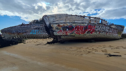 Carcass of boats in a boat cemetery in Brittany in France in February 2022