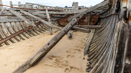 Carcass of boats in a boat cemetery in Brittany in France in February 2022