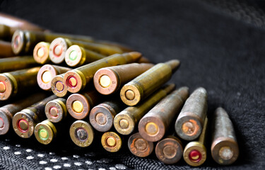 Closeup view of the old bullet butts on dark background, soft and selective focus on bullet butts.