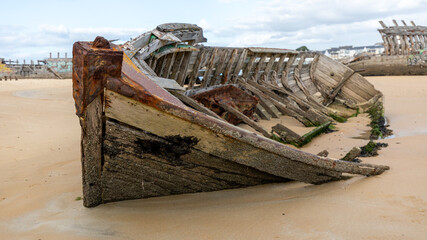 Carcass of boats in a boat cemetery in Brittany in France in February 2022