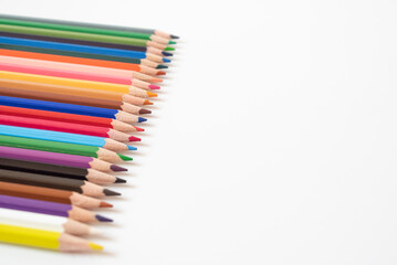 crayons isolated on white background.selective focus.only blue color clear others blurred,top view.