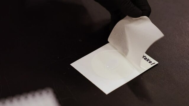 Scientist preparing cannabis for testing.