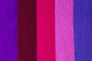 Obraz premium multi colored background. knitted wool fabric texture with stripes