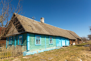Fototapeta na wymiar Old wooden blue house in village.