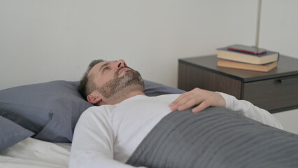 Fototapeta premium Man Awake in Bed Thinking