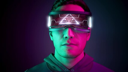 Metahuman. Young man using virtual or augmented reality glasses. High AR technologies in entertainment and education. Neon background. 3d Animation. 4K. 