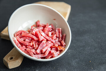 bacon small raw pieces pork meat fumees cuire fresh healthy meal food snack diet on the table copy space food background rustic top view