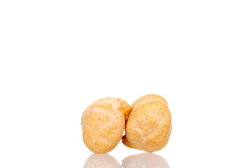 Two uncooked grains of hummus, macro, isolated on white.