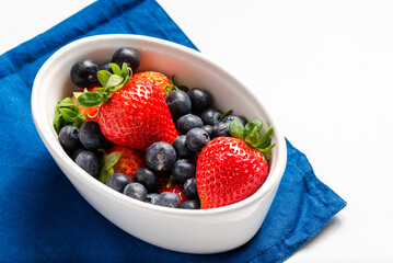 bowl of strawberries and blueberries for 4th July table American independence commemorative dish