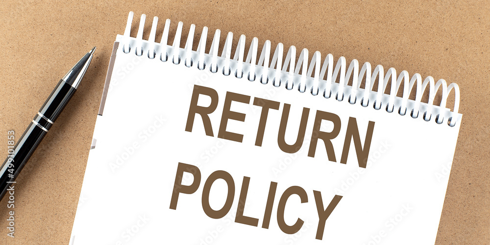 Poster return policy text on a notepad with pen, business concept