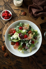 Leaf salad with jamon and raspberry