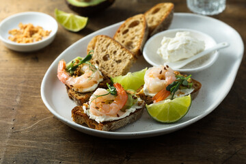 Roasted shrimps with cream cheese on toast