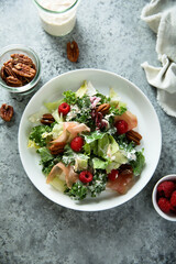 Leaf salad with jamon and raspberry