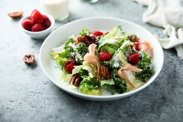Leaf salad with jamon and raspberry