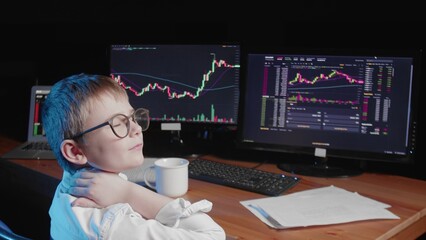 A rear view of a body sitting at a computer and looking at an online stock market chart showing bitcoin currencies. The boy has a sore neck. In real time. Cryptocurrency. Investors