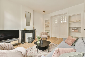 The interior of a spacious living room in an open design with a big sofa and carpet in a cozy house