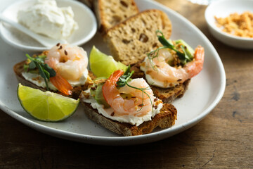 Roasted shrimps with cream cheese on toast