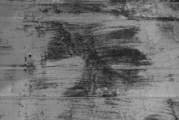 Obraz premium grey background. on the photo is an old gray wall with traces of paint, close-up