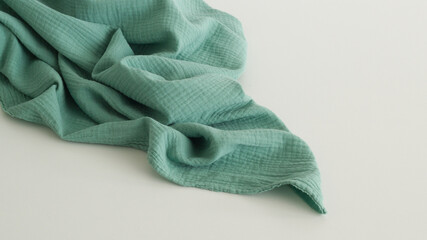 Muslin cloth texture background in neutral tones. Muslin cotton fabric of plain weave. Muslin is a...