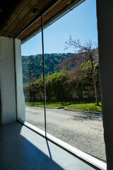 Large panoramic window. Beautiful view from the window to the mountains and the forest.