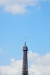 Fototapeta na wymiar The Eiffel Tower summit with its new antenna, in a sunny morning in Paris, France