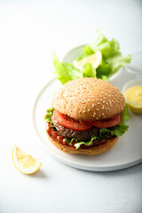 Traditional homemade burger with fresh tomato