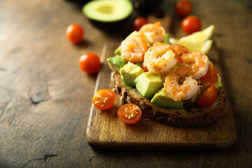 Shrimp toast with tomato and avocado