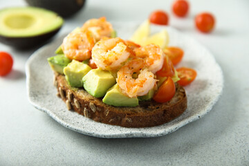 Shrimp toast with tomato and avocado