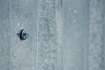 roofing sheet iron, in the photo is a screw fastening a corrugated iron sheet