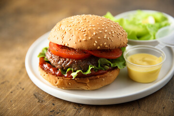 Traditional homemade burger with fresh tomato