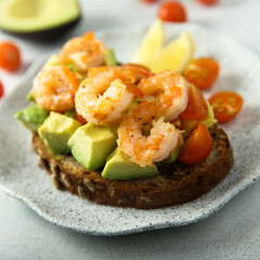 Shrimp toast with tomato and avocado