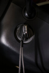 The ignition in an automobile and key.